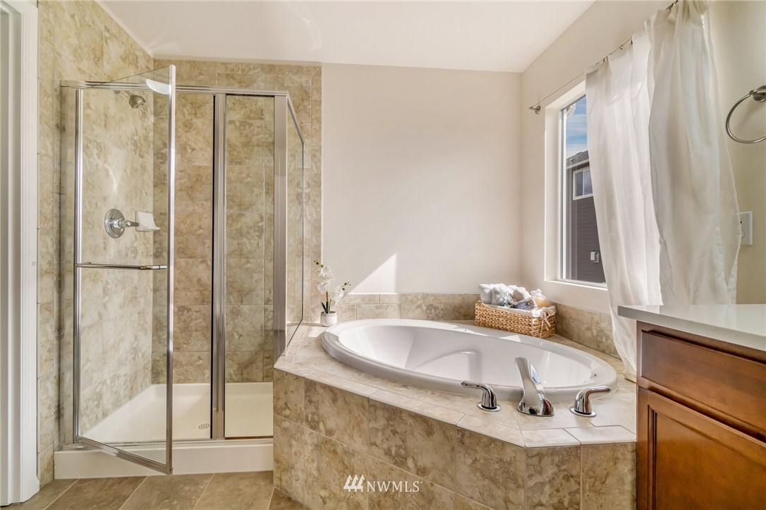 4114 167th Place Southeast Bothell, WA 98012 - Photo 26 of 38 a bathroom with a tub and a sink