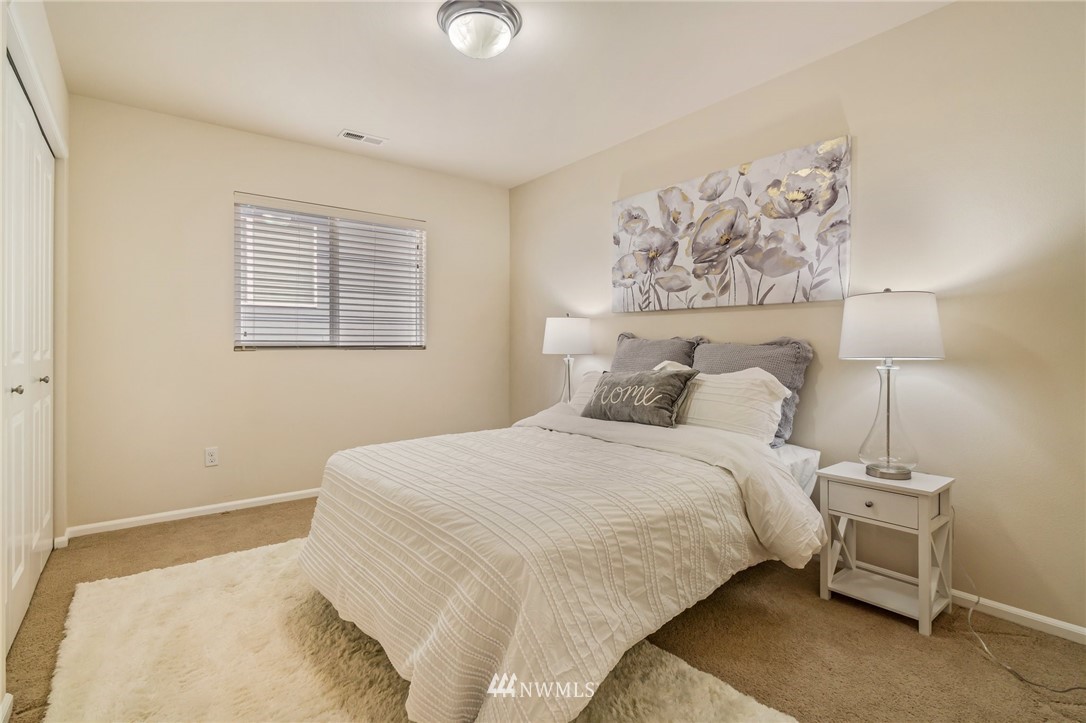 4114 167th Place Southeast Bothell, WA 98012 - Photo 28 of 38 a bedroom with a bed and a painting on the wall
