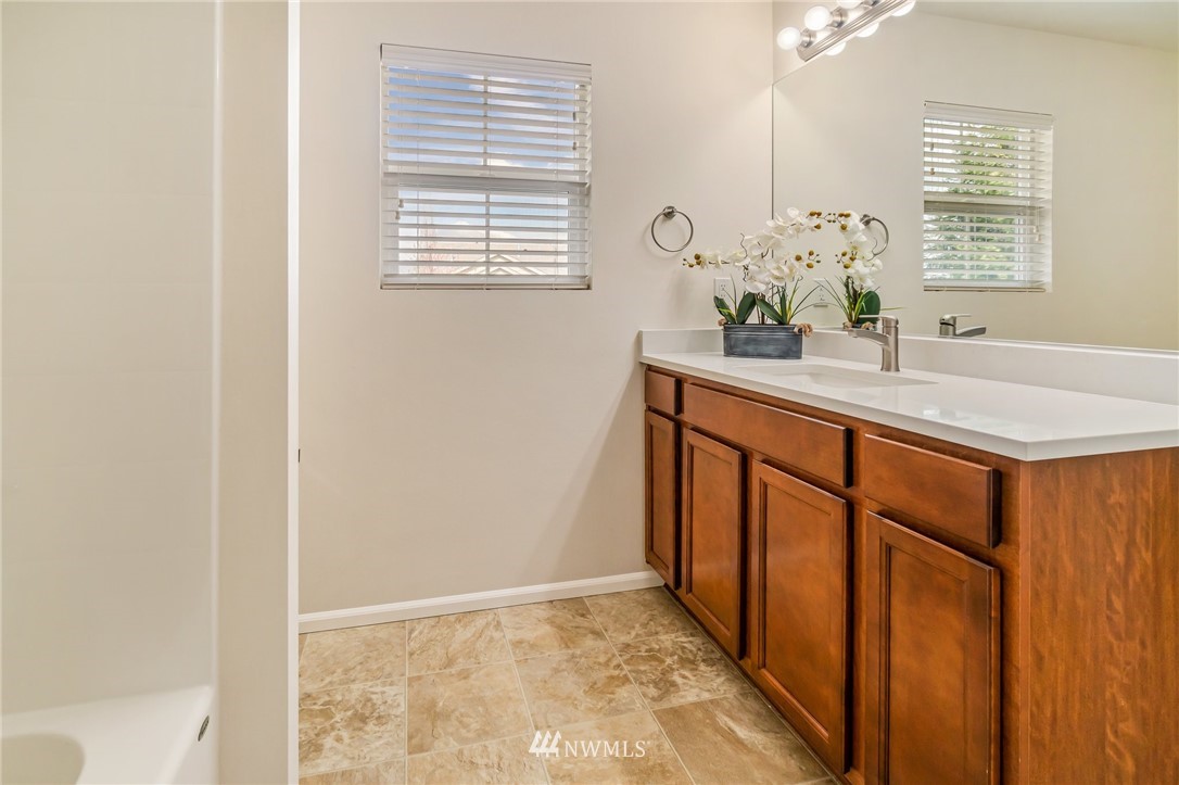 4114 167th Place Southeast Bothell, WA 98012 - Photo 29 of 38 a bathroom with a sink and a mirror