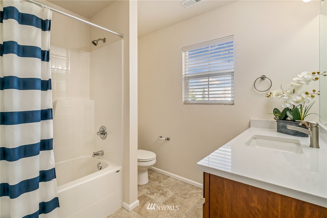 4114 167th Place Southeast Bothell, WA 98012 - Photo 30 of 38 a bathroom with a sink a toilet and shower