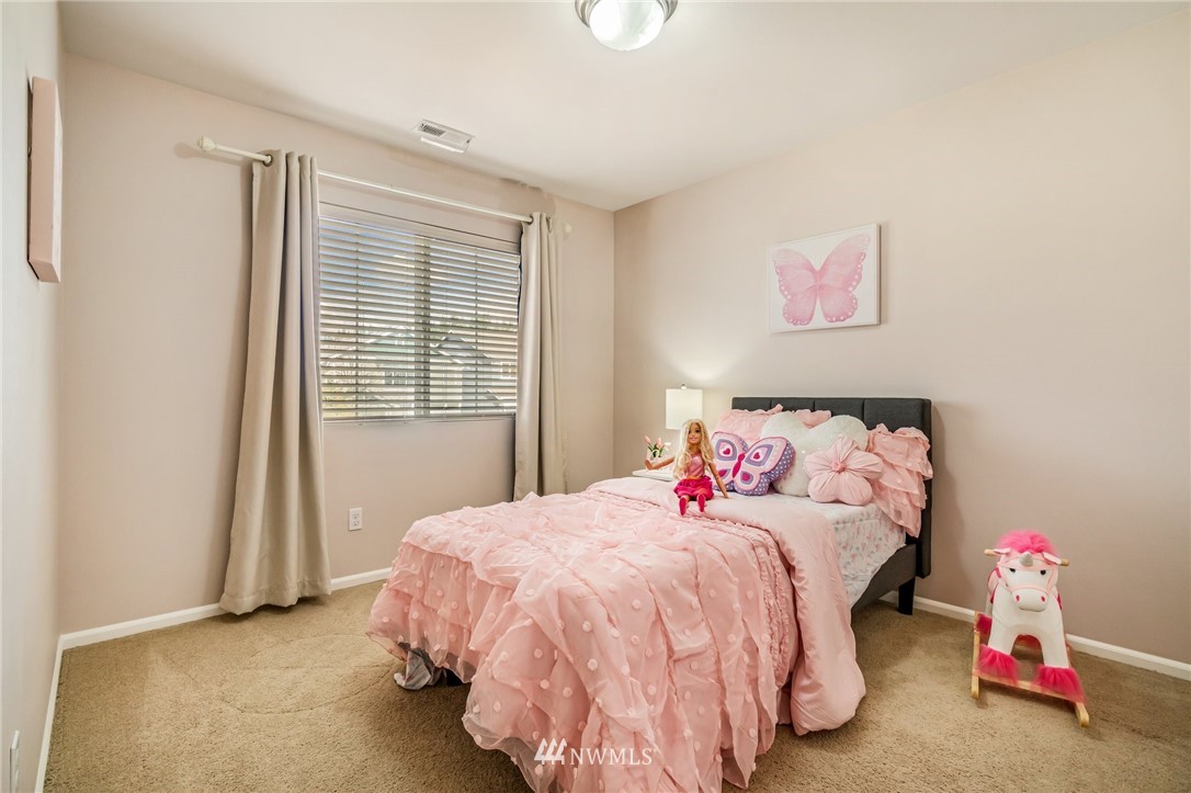 4114 167th Place Southeast Bothell, WA 98012 - Photo 31 of 38 a bedroom with a bed and a window