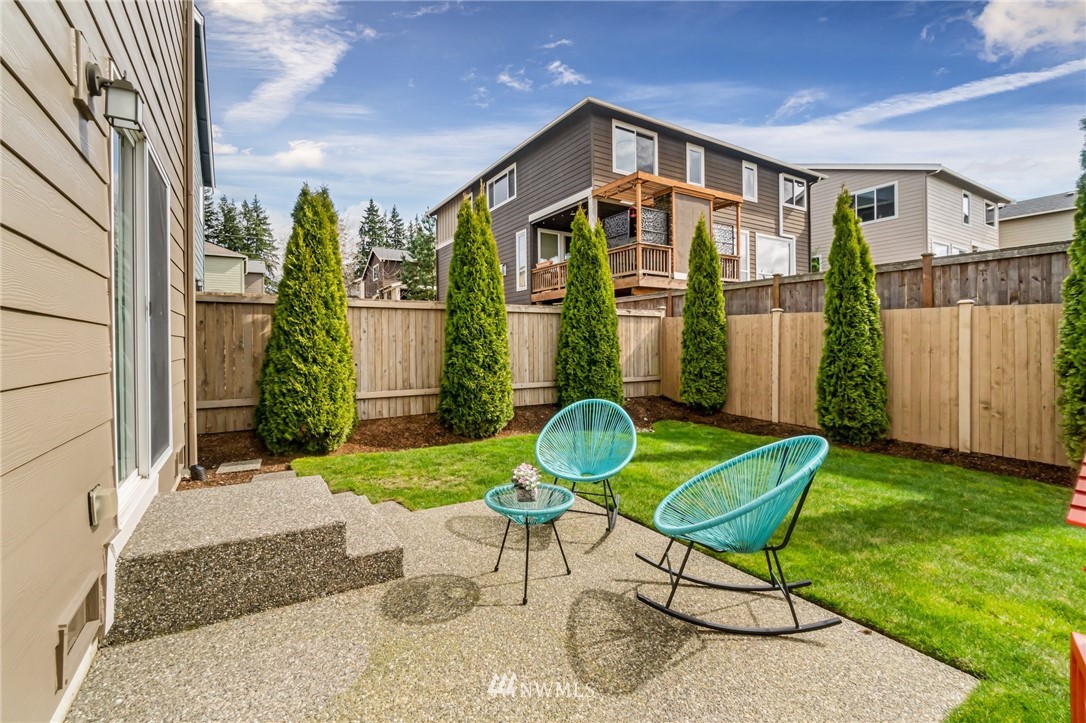 4114 167th Place Southeast Bothell, WA 98012 - Photo 34 of 38 a front view of a house with garden and patio