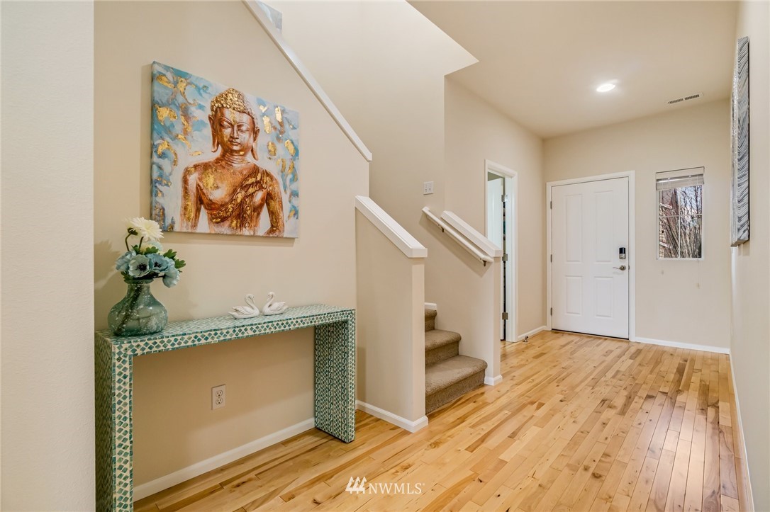 4114 167th Place Southeast Bothell, WA 98012 - Photo 4 of 38 workspace with wooden floor and hallway