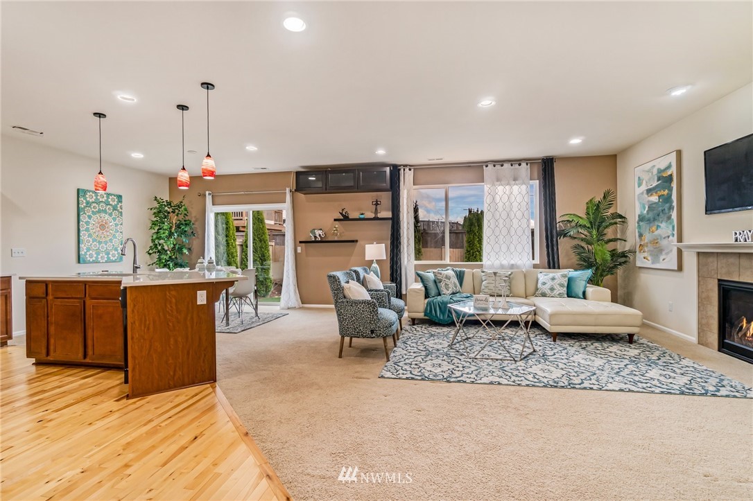 4114 167th Place Southeast Bothell, WA 98012 - Photo 5 of 38 a living room with furniture kitchen view and a large window