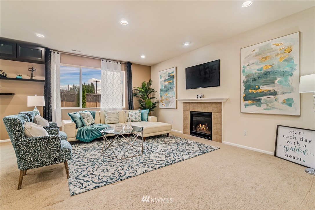 4114 167th Place Southeast Bothell, WA 98012 - Photo 7 of 38 a living room with furniture fireplace and flat screen tv