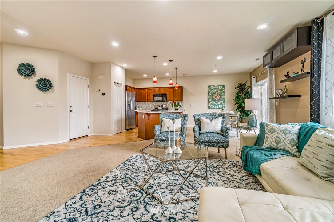 4114 167th Place Southeast Bothell, WA 98012 - Photo 9 of 38 a living room with furniture and a large window