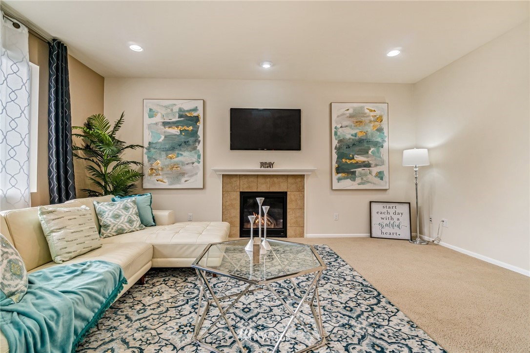 4114 167th Place Southeast Bothell, WA 98012 - Photo 10 of 38 a living room with furniture and a fireplace