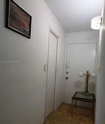 a view of hallway with shower