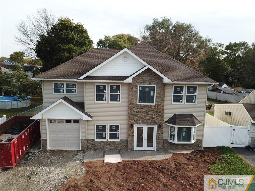 30 Sturgis Road Edison, NJ 08817 - Photo 1 of 5 a view of a house with a yard and large trees