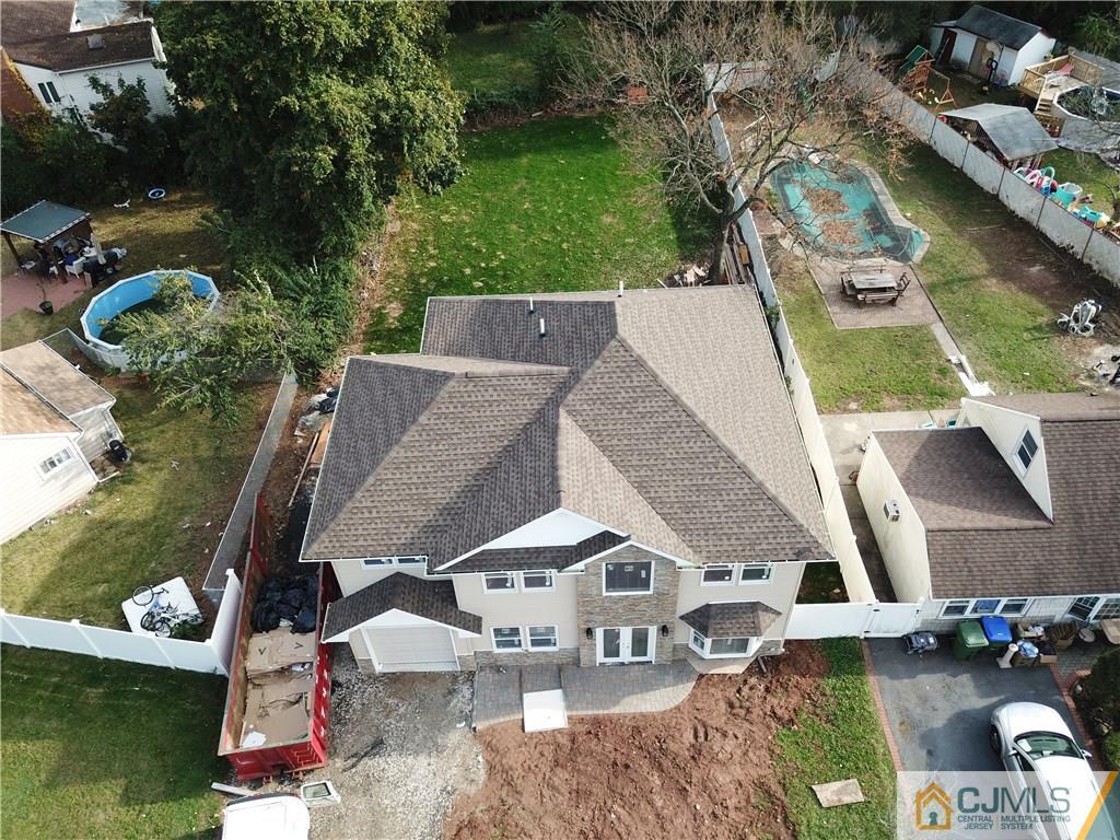 30 Sturgis Road Edison, NJ 08817 - Photo 2 of 5 an aerial view of a house with a yard pool outdoor space and seating area