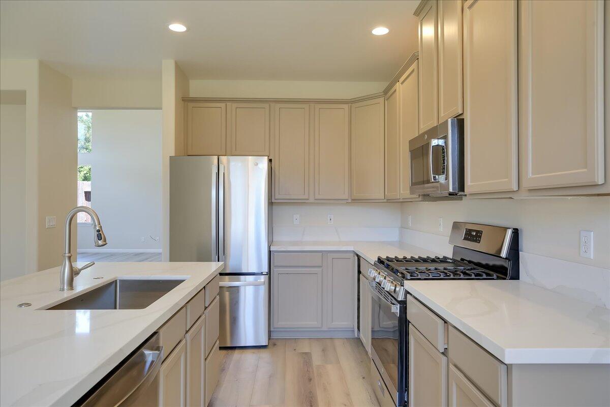 321 Alder Lane Buellton, CA 93427 - Photo 12 of 42 a kitchen with stainless steel appliances granite countertop a sink stove and refrigerator