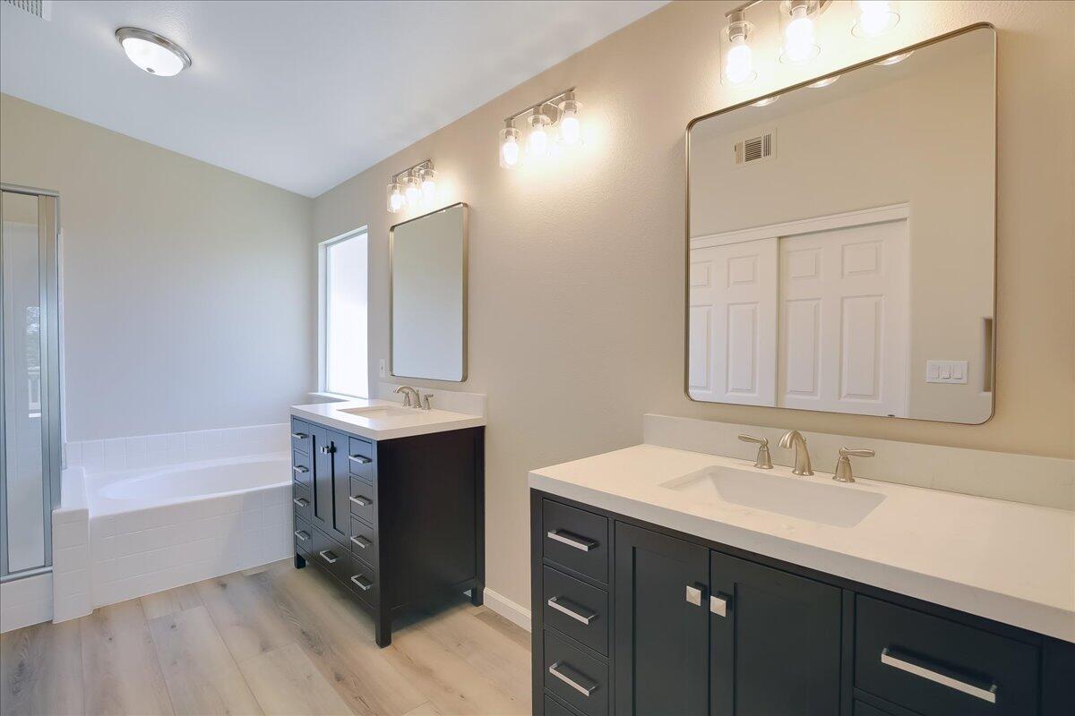 321 Alder Lane Buellton, CA 93427 - Photo 21 of 42 a bathroom with a tub sink and mirror