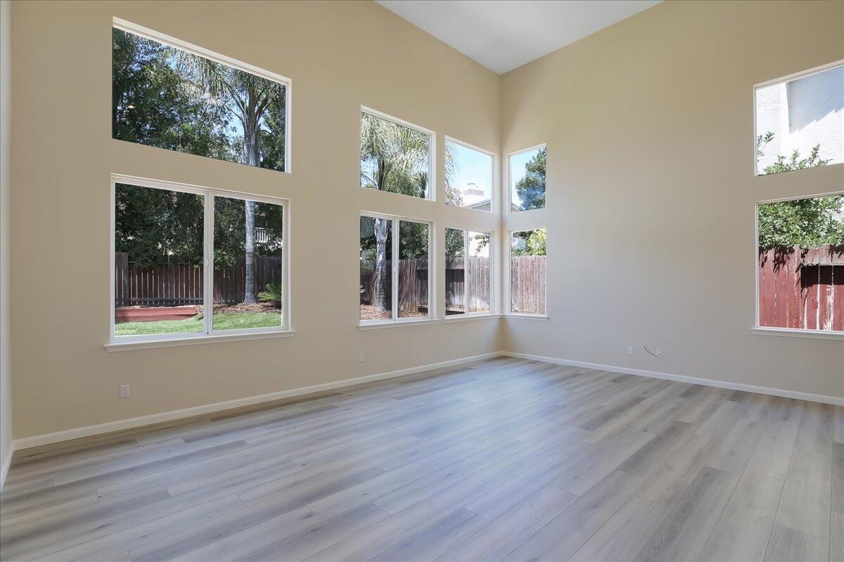 321 Alder Lane Buellton, CA 93427 - Photo 6 of 42 a view of an empty room with wooden floor and a window