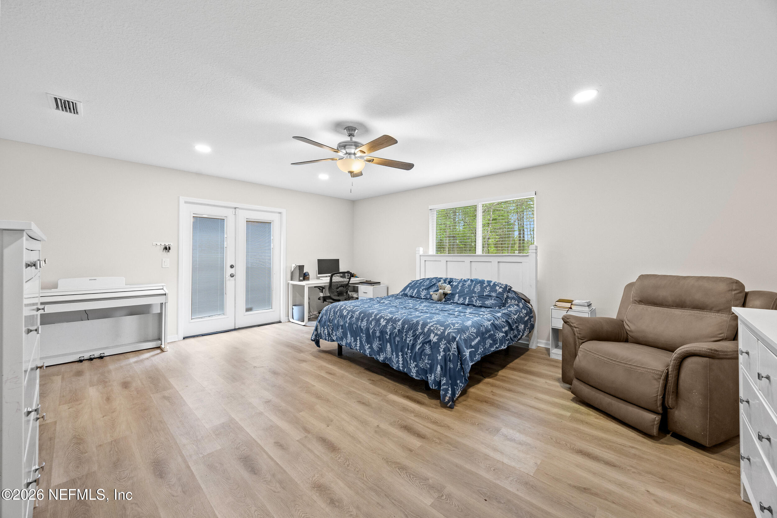 2030 Wayfare Lane Middleburg, FL 32068 - Photo 12 of 46 a bedroom with a bed and window