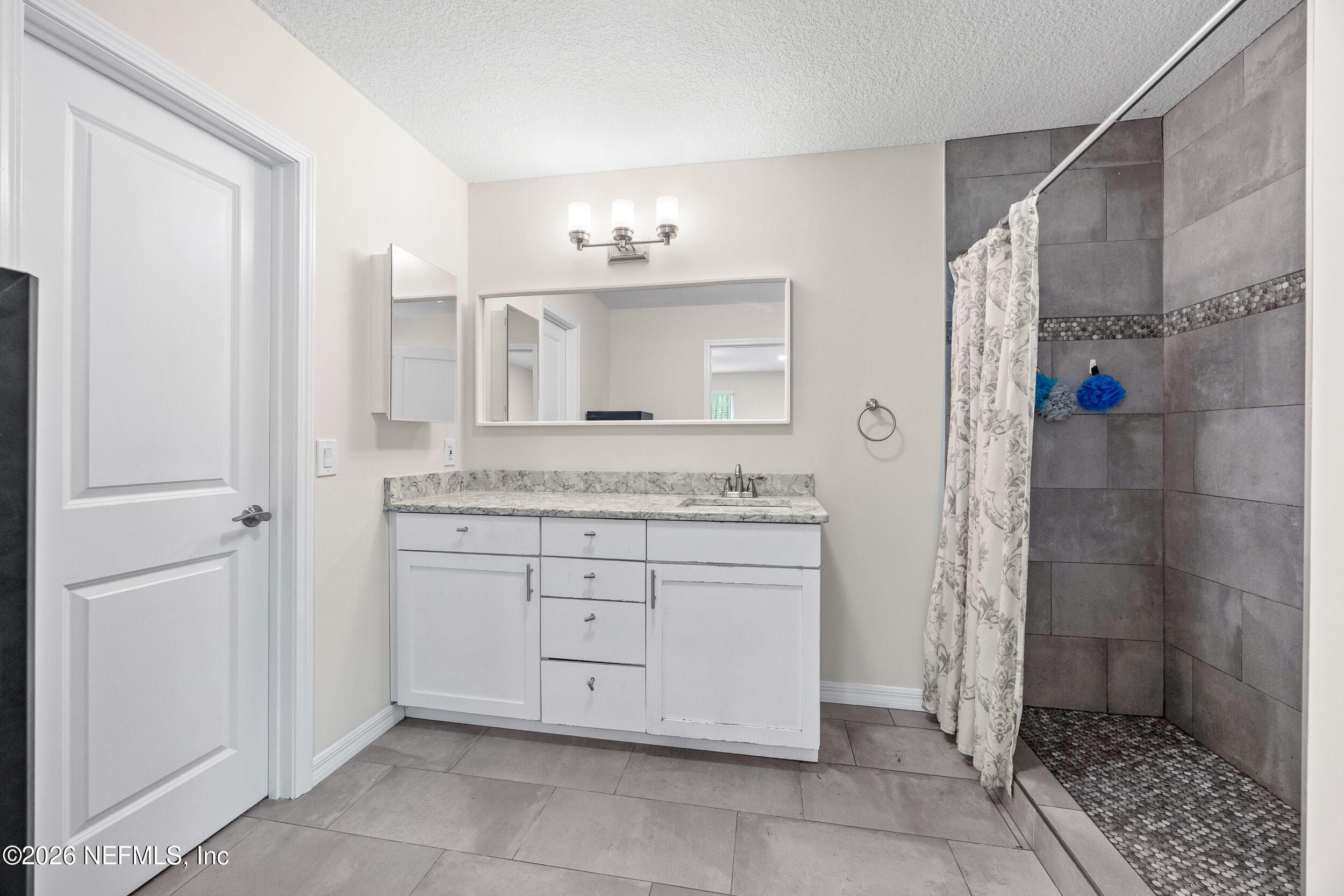 2030 Wayfare Lane Middleburg, FL 32068 - Photo 15 of 46 a bathroom with a granite countertop sink mirror and toilet