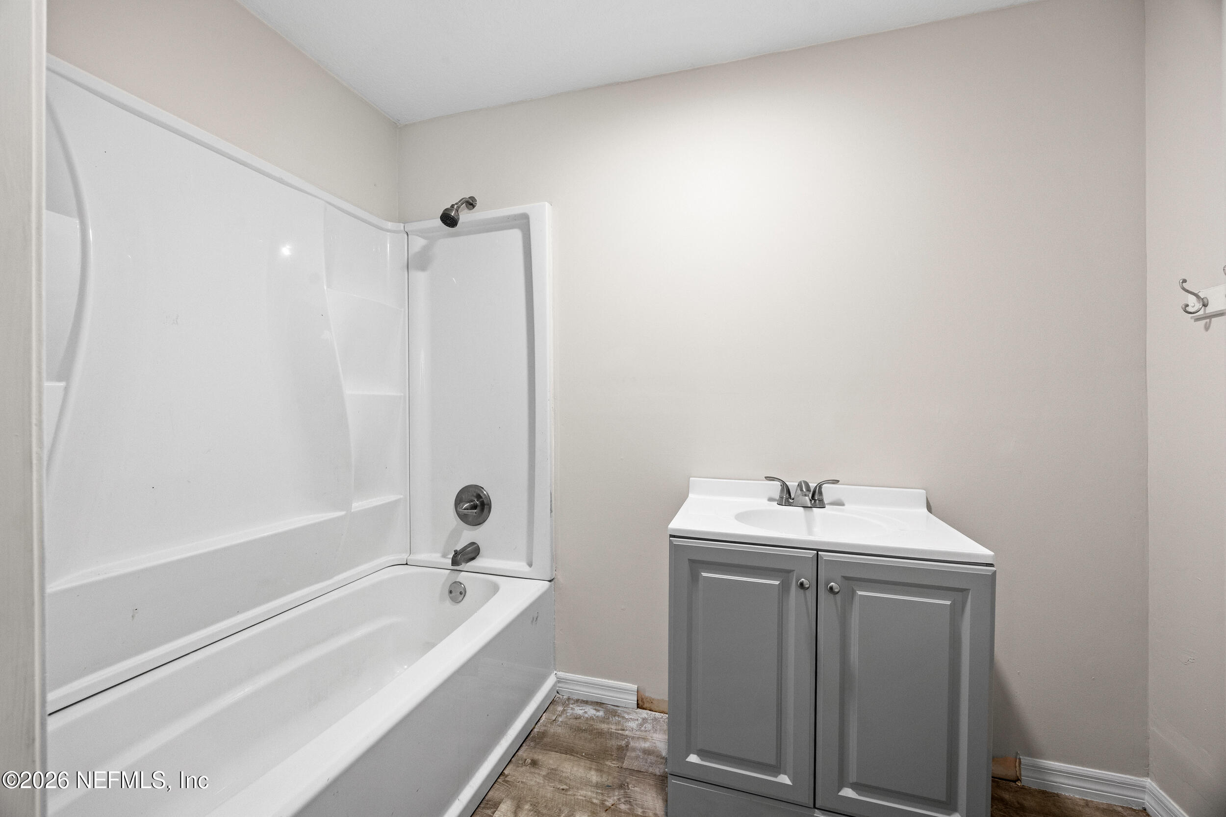 2030 Wayfare Lane Middleburg, FL 32068 - Photo 22 of 46 a bathroom with a tub sink and mirror