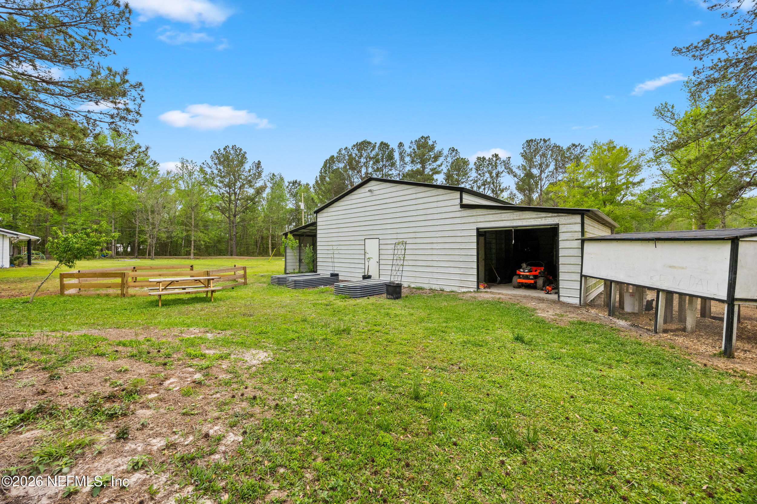 2030 Wayfare Lane Middleburg, FL 32068 - Photo 27 of 46 a view of a house with backyard and garden