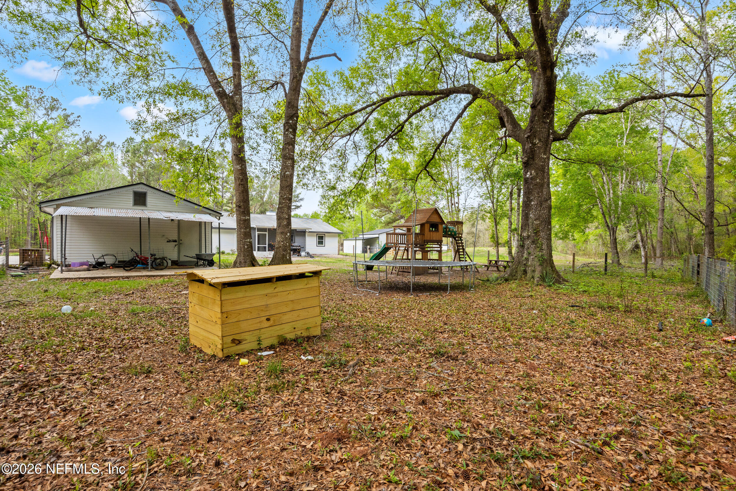 2030 Wayfare Lane Middleburg, FL 32068 - Photo 34 of 46 a view of a house with backyard and sitting area