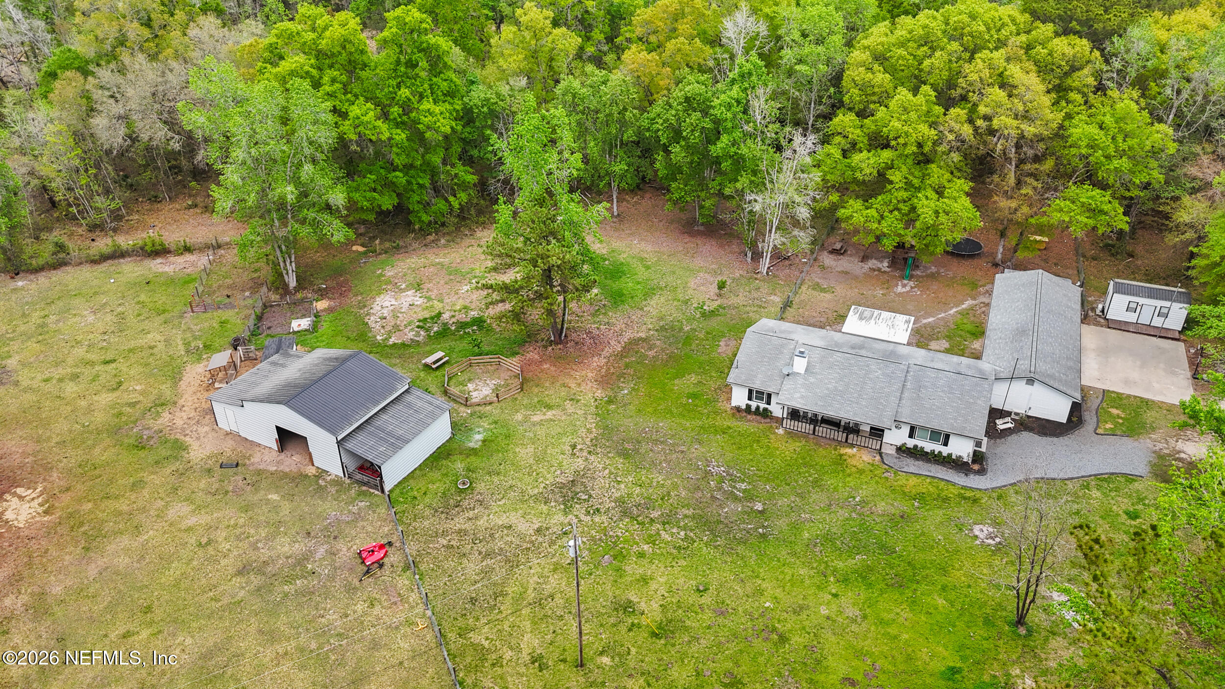 2030 Wayfare Lane Middleburg, FL 32068 - Photo 38 of 46 a backyard of a house with table and chairs