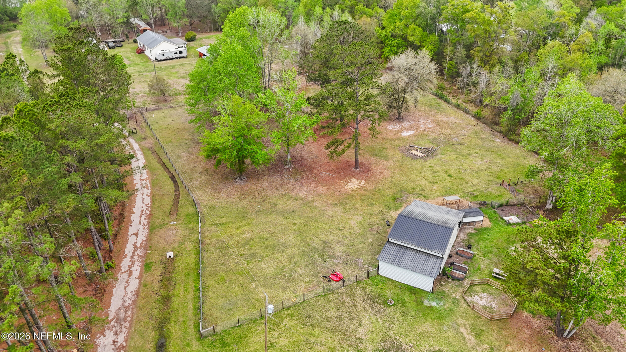 2030 Wayfare Lane Middleburg, FL 32068 - Photo 40 of 46 an aerial view of residential house with outdoor space and trees all around