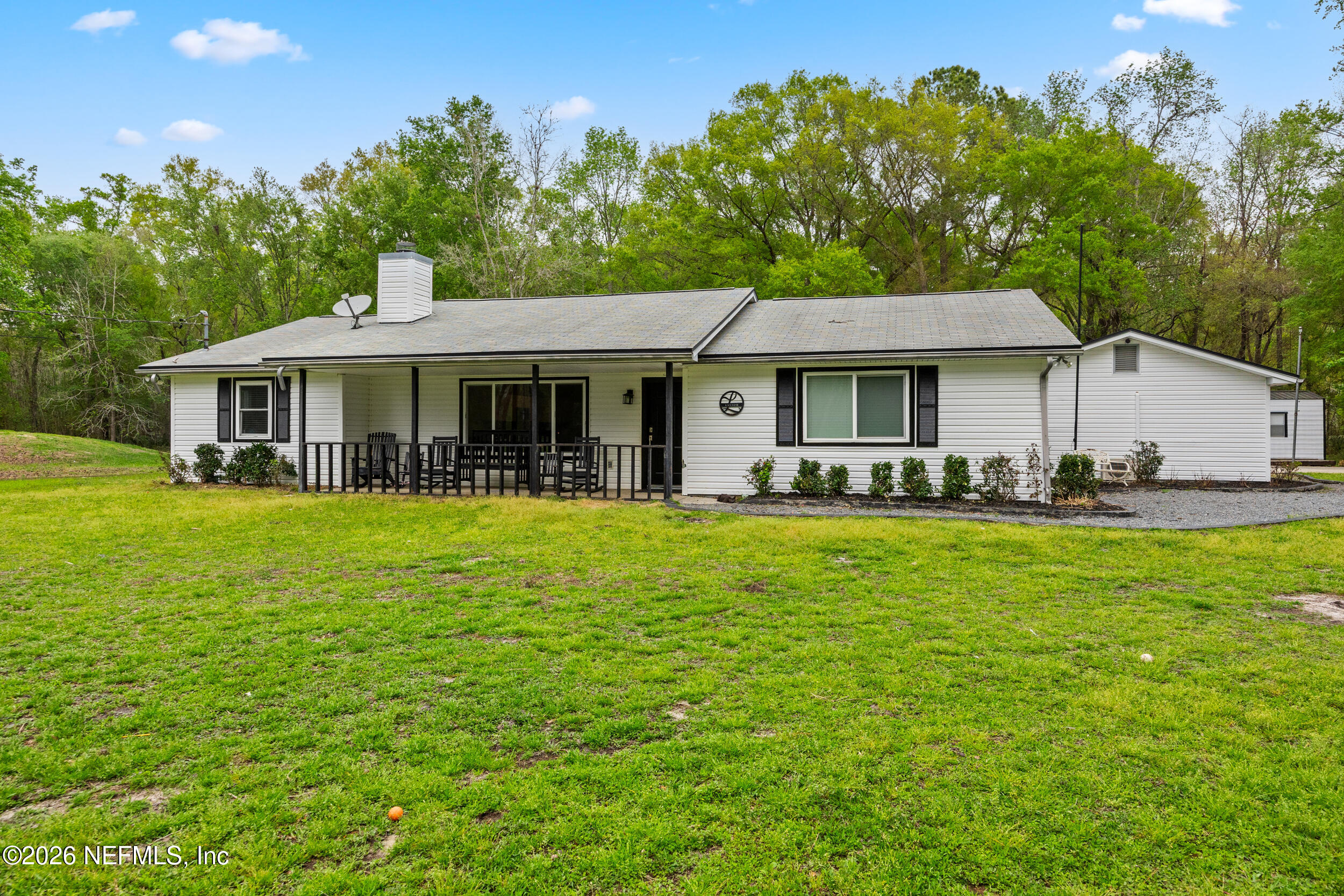 2030 Wayfare Lane Middleburg, FL 32068 - Photo 44 of 46 a front view of a house with a garden