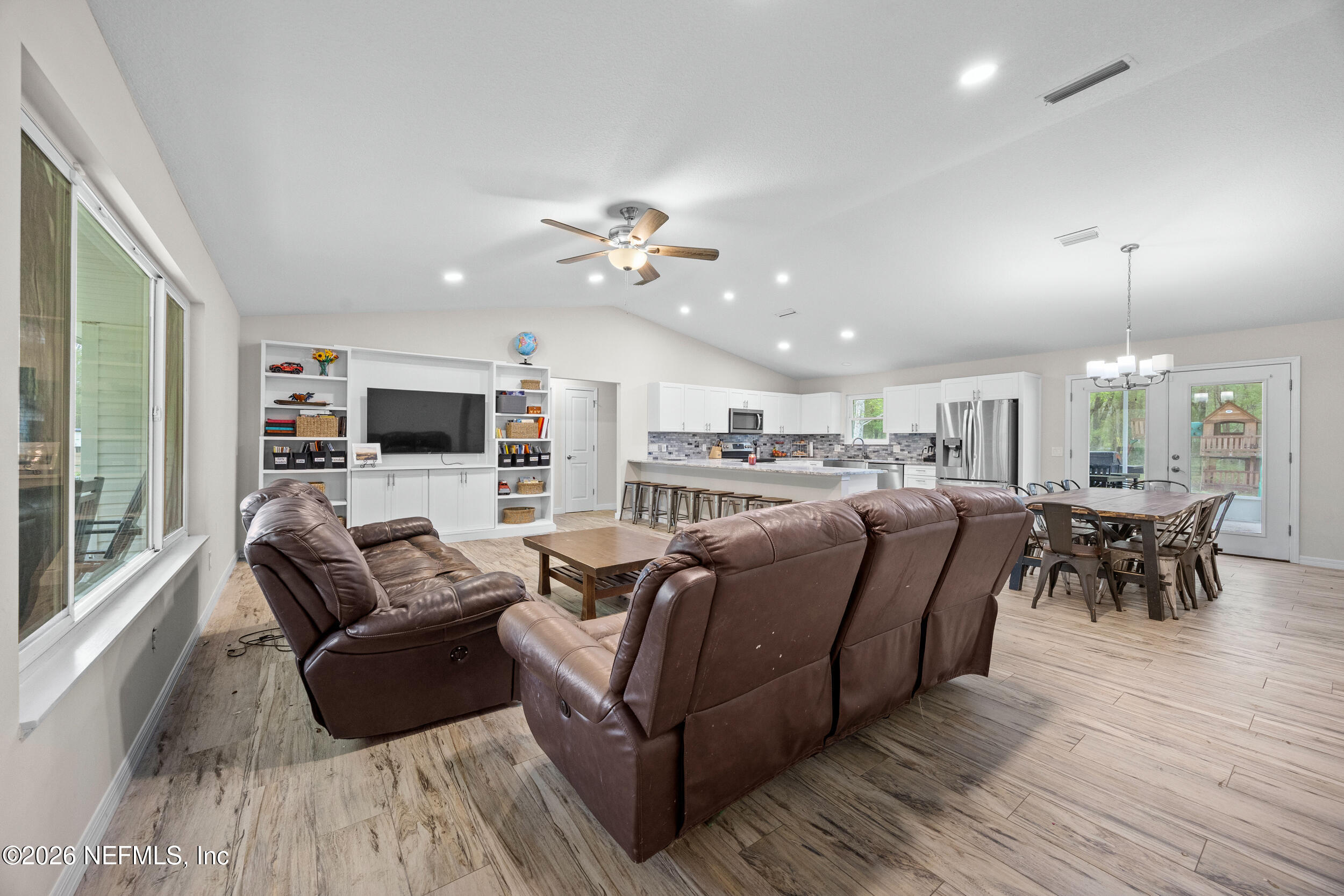 2030 Wayfare Lane Middleburg, FL 32068 - Photo 5 of 46 a living room with furniture and a flat screen tv