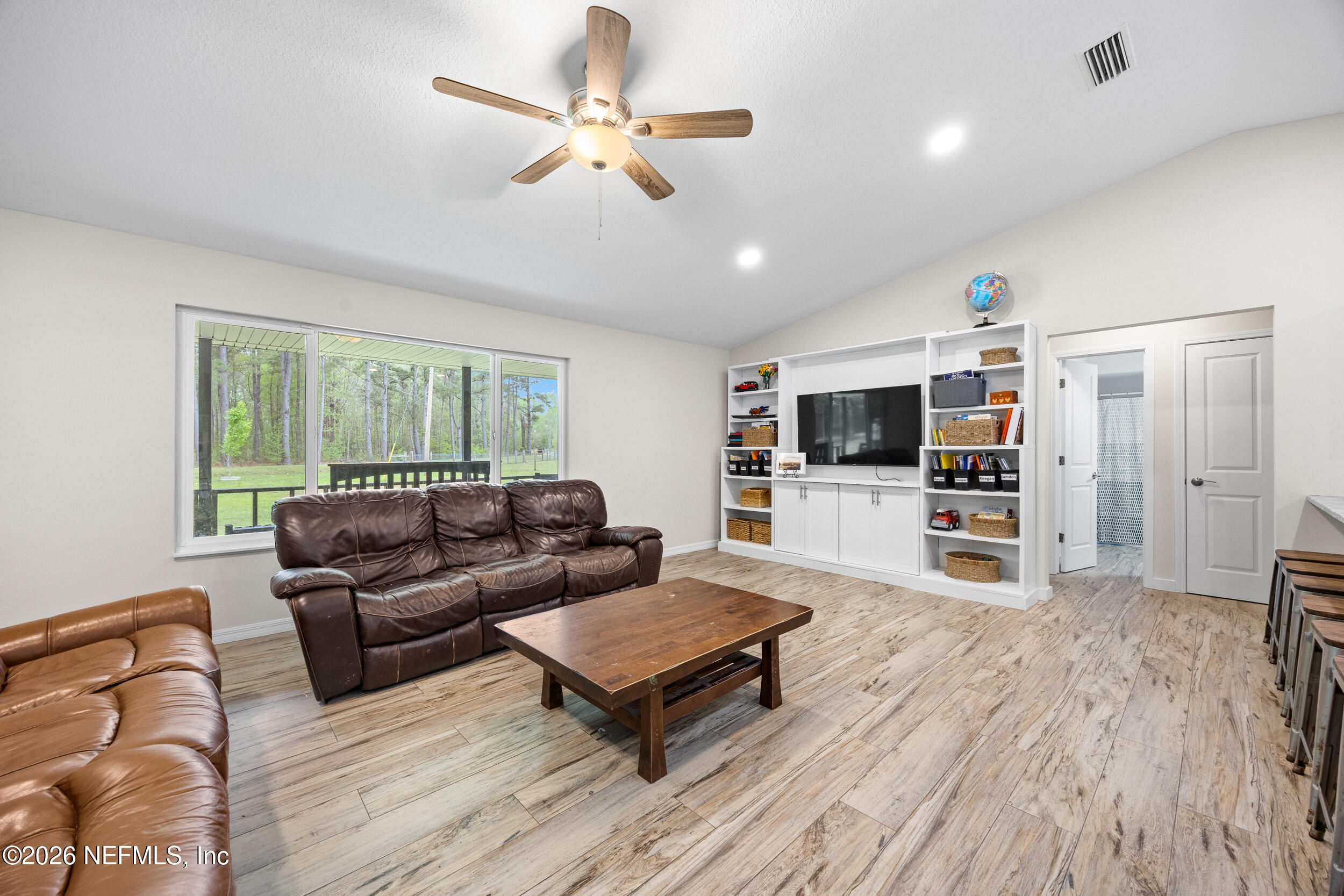 2030 Wayfare Lane Middleburg, FL 32068 - Photo 6 of 46 a living room with furniture and a flat screen tv