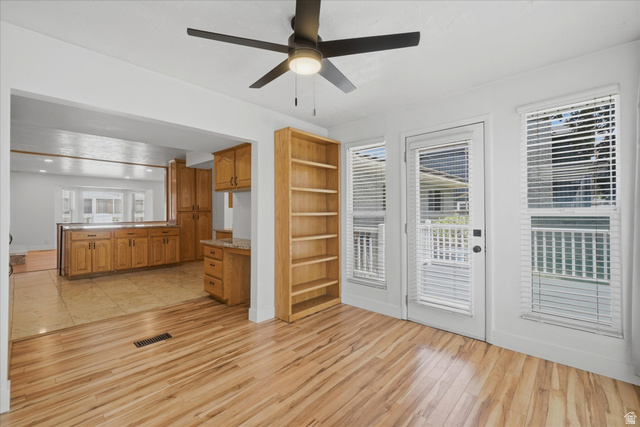 392 Perrine Drive Midvale, UT 84047 - Photo 11 of 37 Bright room with wood-finish flooring and a ceiling fan