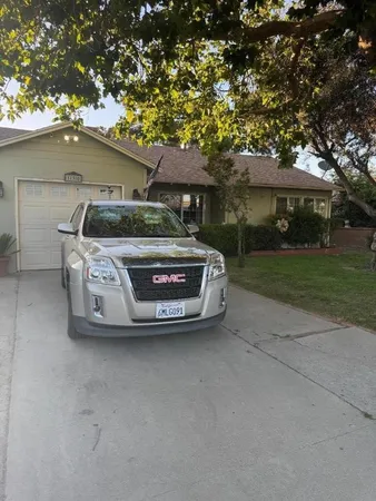 front view of a house with a tree