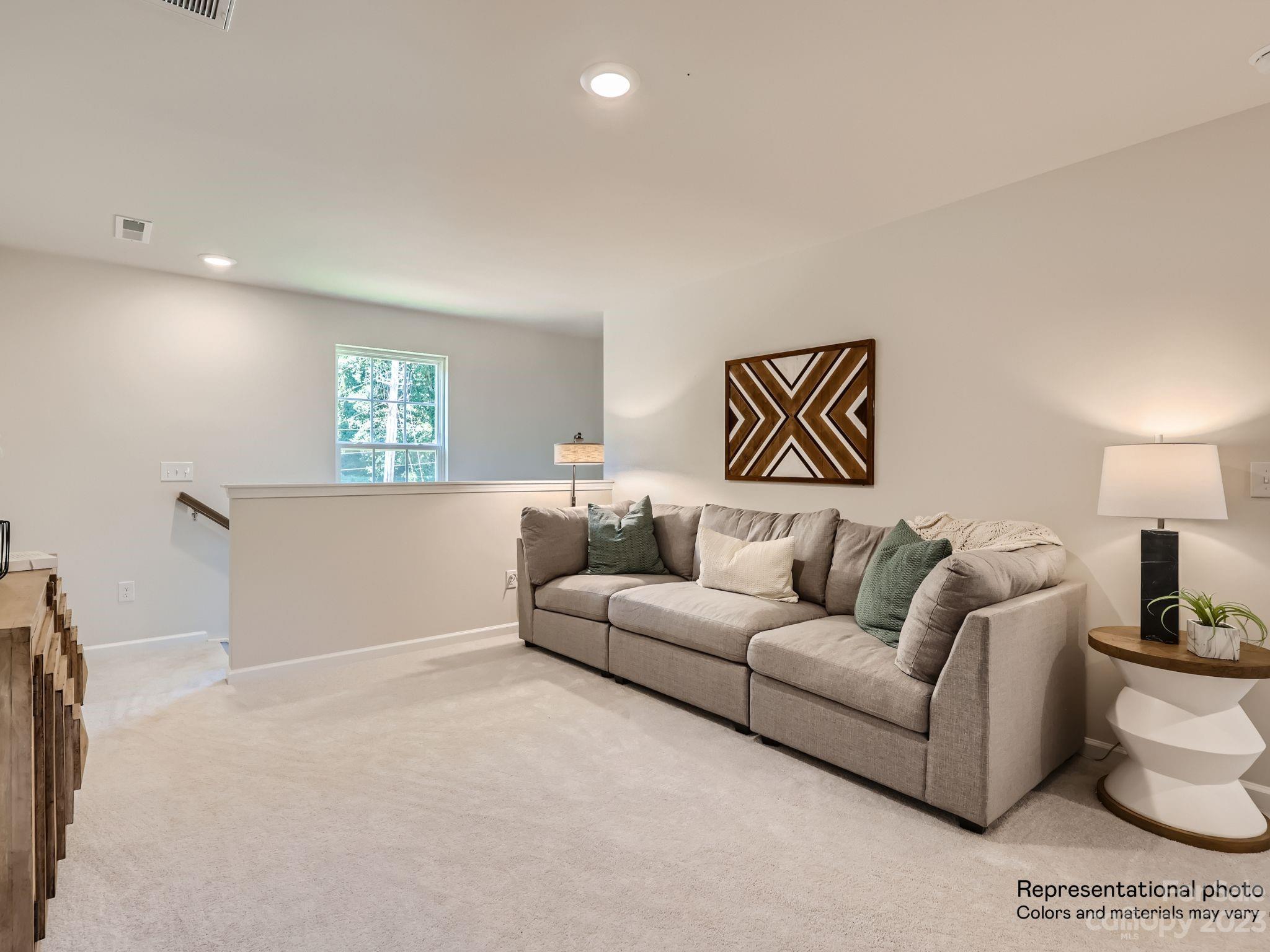 2775 Legacy Rdg Lane, Unit 112 Catawba, NC 28609 - Photo 7 of 12 a living room with furniture and a couch