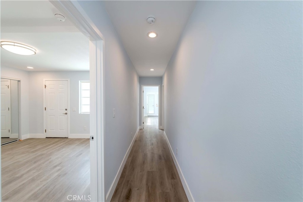 4569 Whitney Drive El Monte, CA 91731 - Photo 15 of 41 a view of a hallway with wooden floor