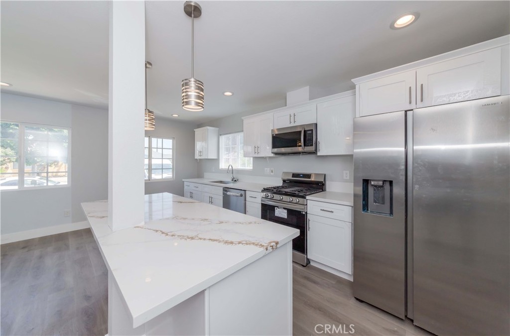 4569 Whitney Drive El Monte, CA 91731 - Photo 21 of 41 a kitchen with stainless steel appliances a refrigerator sink and microwave