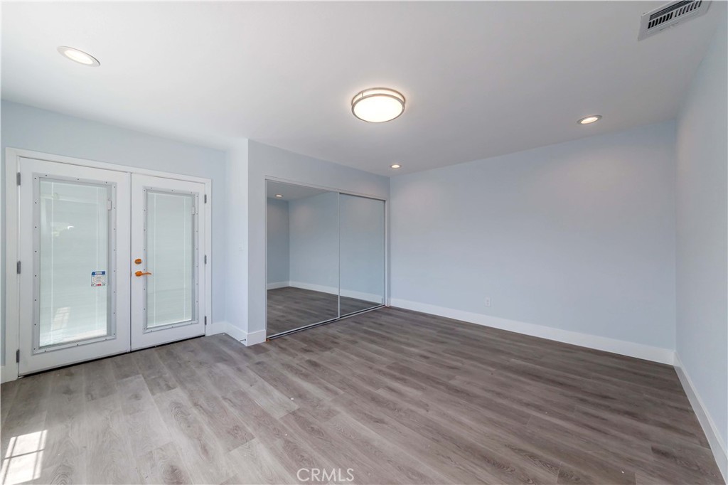 4569 Whitney Drive El Monte, CA 91731 - Photo 7 of 41 a view of an empty room with wooden floor and closet