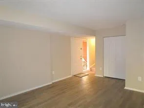 a view of an empty room and a window