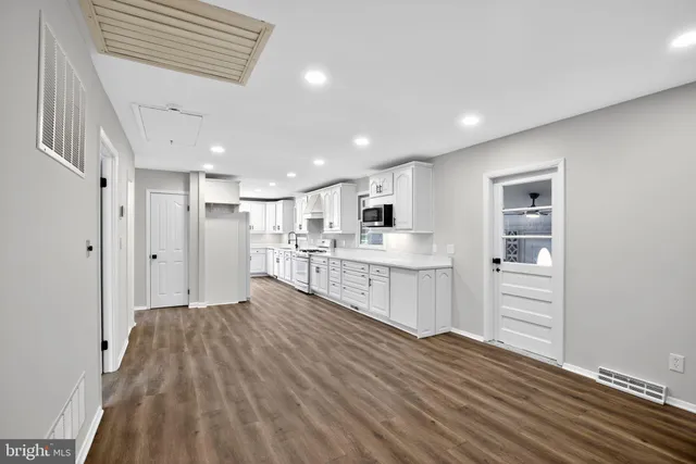 a view of kitchen with wooden floor