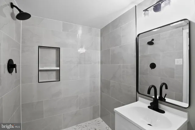 a bathroom with a sink and mirror