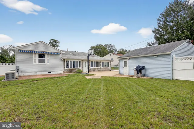 a front view of house with yard and seating area