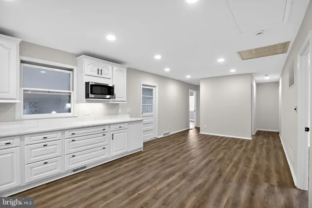 a view of a kitchen with electric appliances