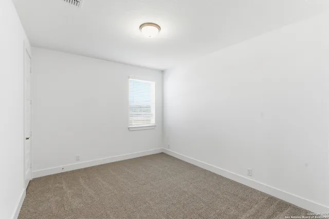 an empty room with a window