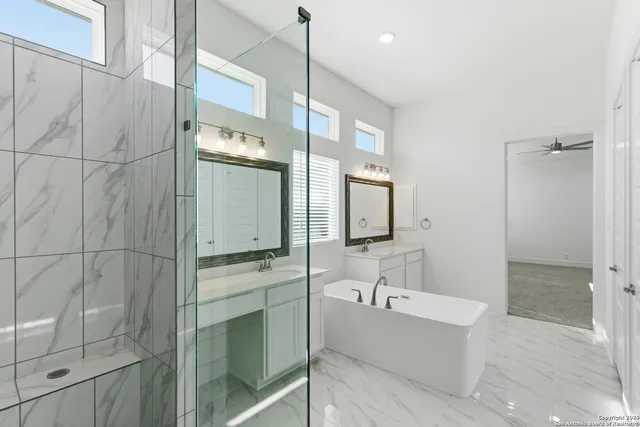 a bathroom with a bathtub and a shower