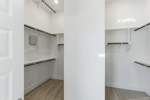 a view of an empty walk in closet