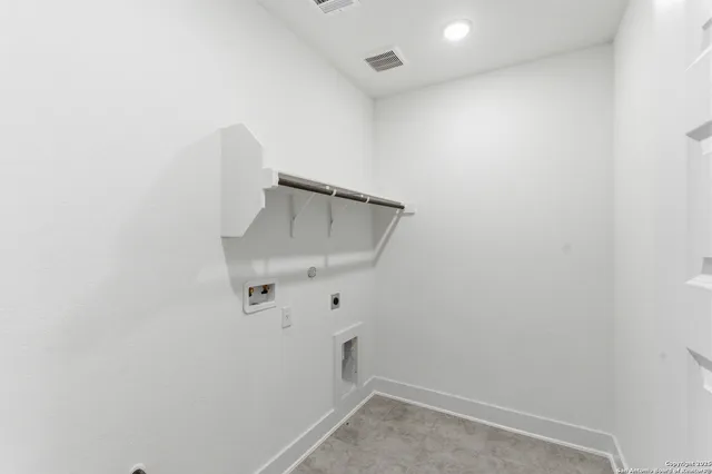 a view of storage and utility room with empty racks