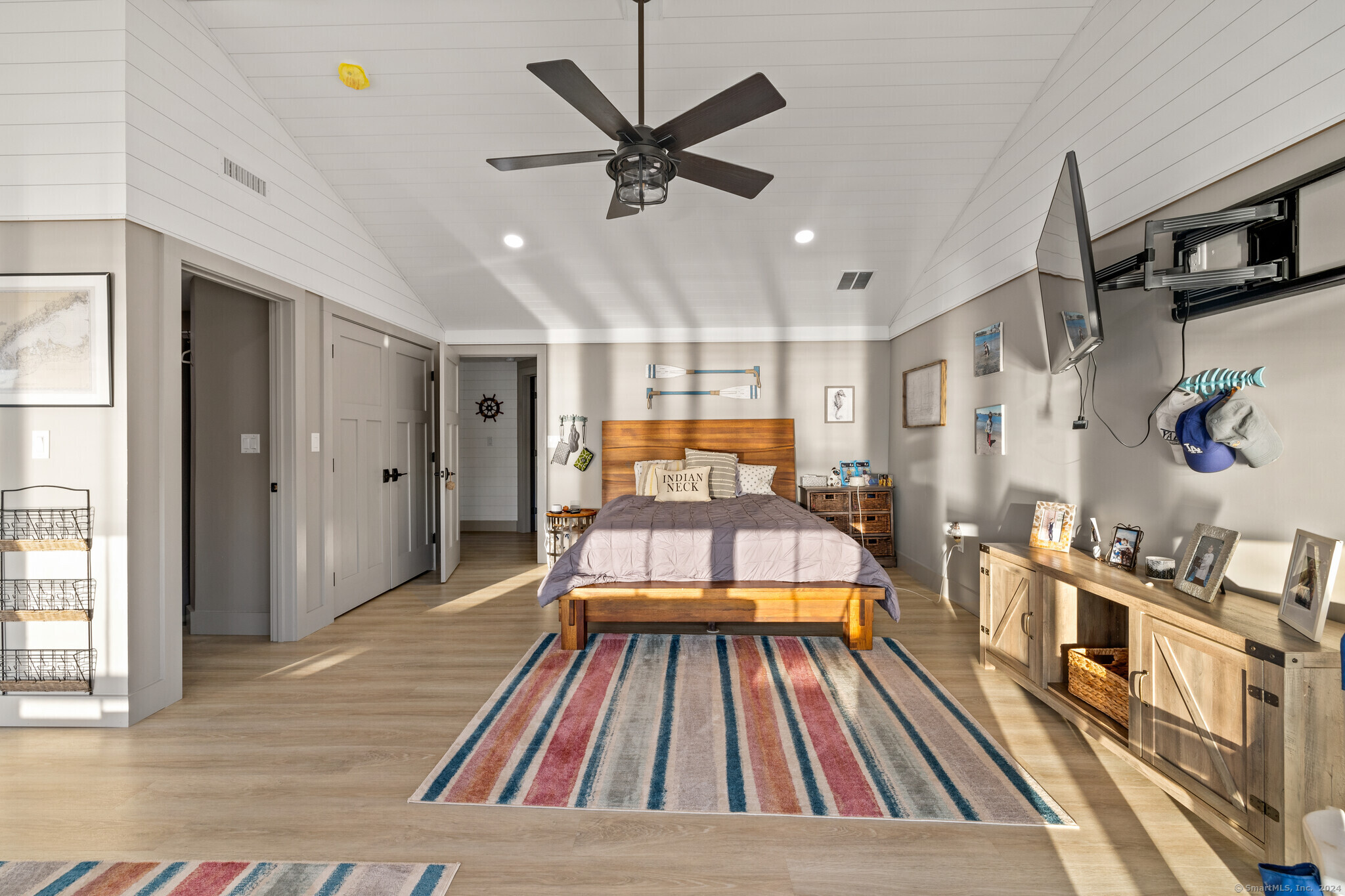 29 Sagamore Cove Road Branford, CT 06405 - Photo 10 of 32 Primary bedroom with ensuite bathroom and balcony overlooking Long Island Sound panoramic views