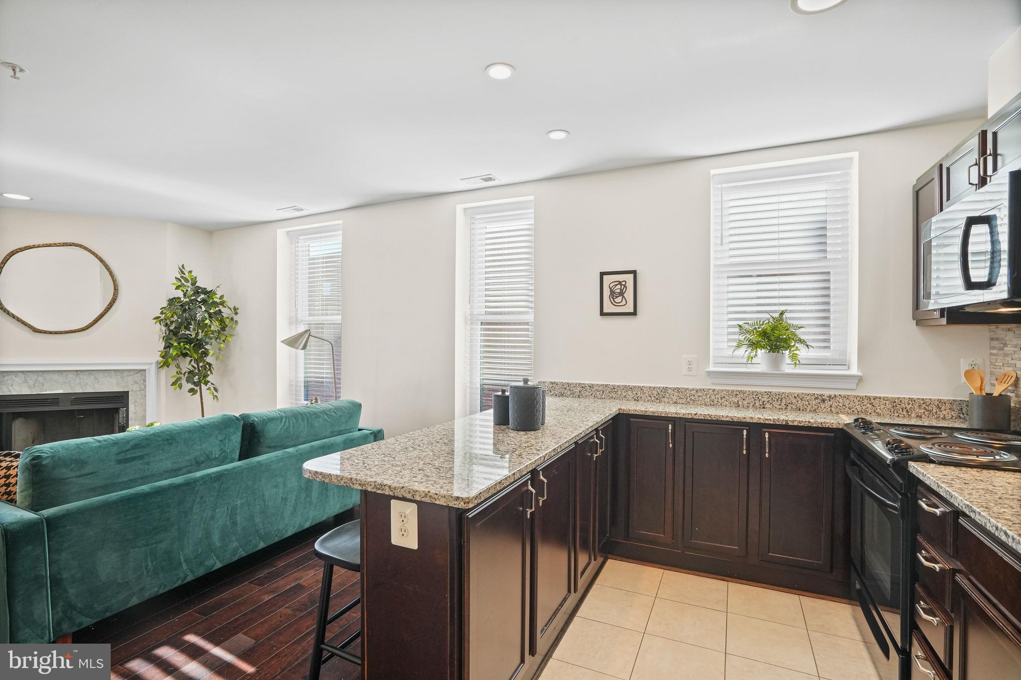 2627 Adams Mill Road Northwest, Unit 402 Washington, DC 20009 - Photo 9 of 17 Open layout from kitchen to living area