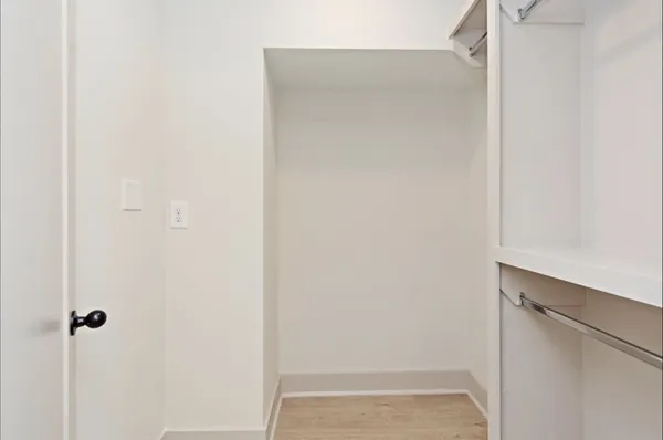 a bathroom with a glass shower door