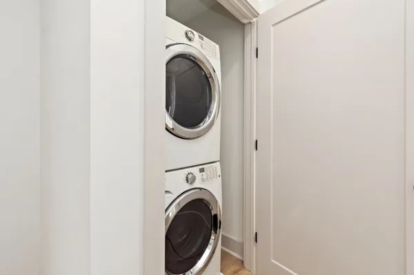 a view of a hallway with washer and dryer