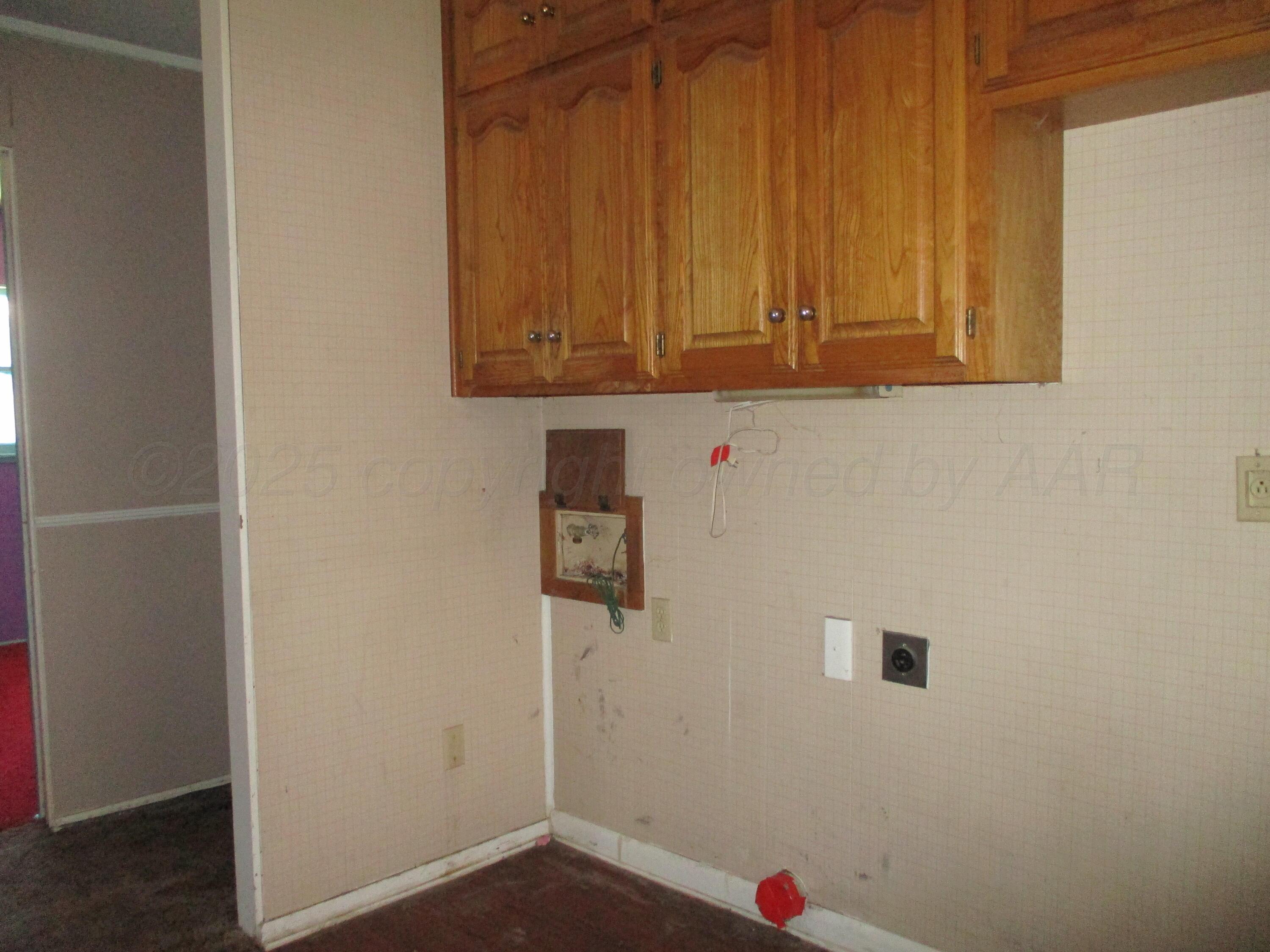 1502 Lancelot Street Borger, TX 79007 - Photo 12 of 16 Utility in the corner of the Kitchen