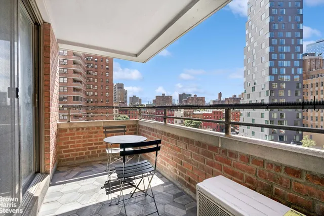 a view of a balcony with city view