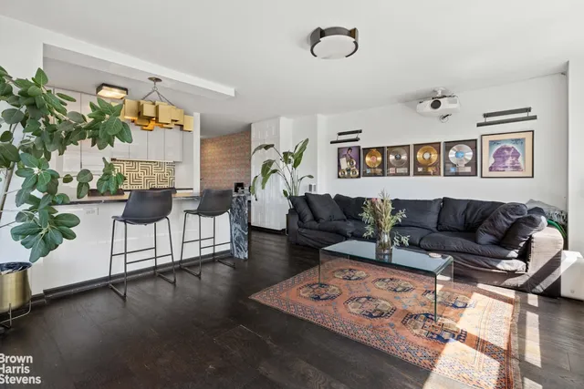 a living room with furniture and a rug