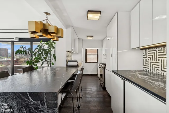 a kitchen with sink and refrigerator